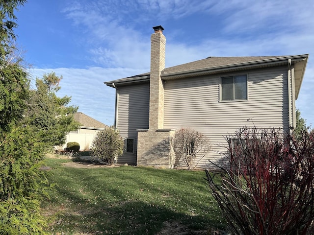 view of property exterior with a yard