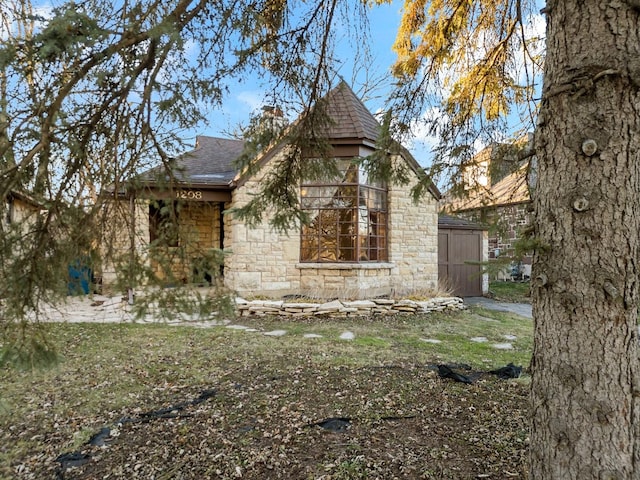 view of property exterior with a shed