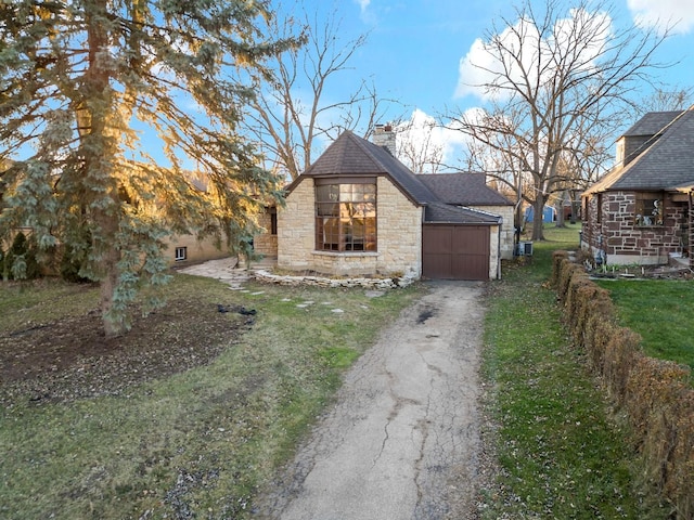 view of side of home with a lawn