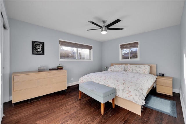 bedroom with ceiling fan, dark hardwood / wood-style flooring, and a closet