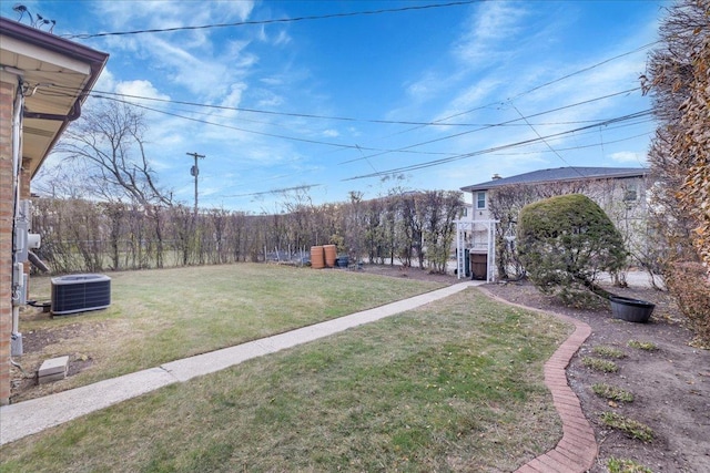 view of yard featuring central air condition unit