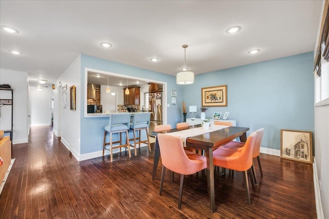 dining space featuring dark hardwood / wood-style flooring