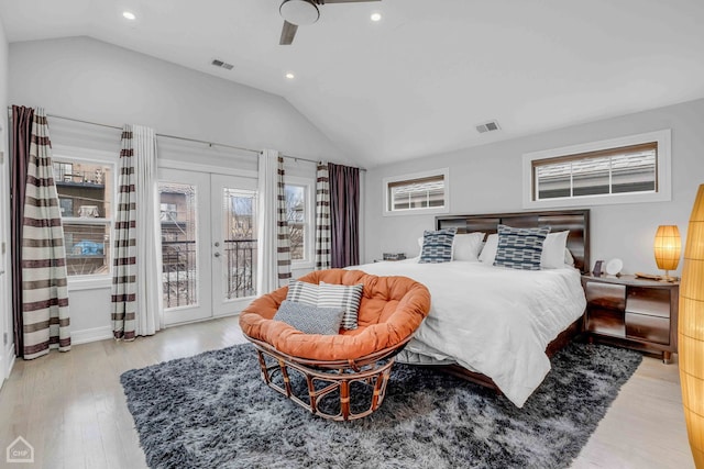 bedroom with vaulted ceiling, light hardwood / wood-style flooring, access to outside, ceiling fan, and french doors