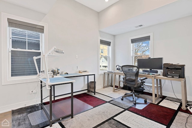 home office with wood-type flooring