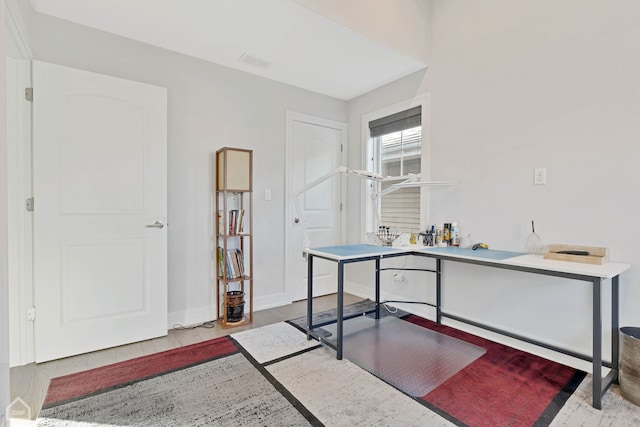 office space with light hardwood / wood-style floors