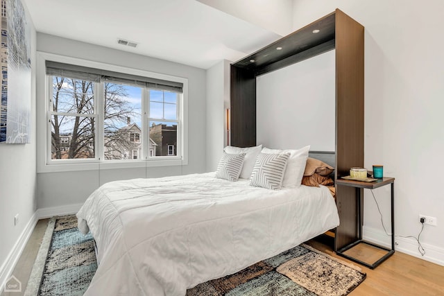 bedroom featuring hardwood / wood-style floors