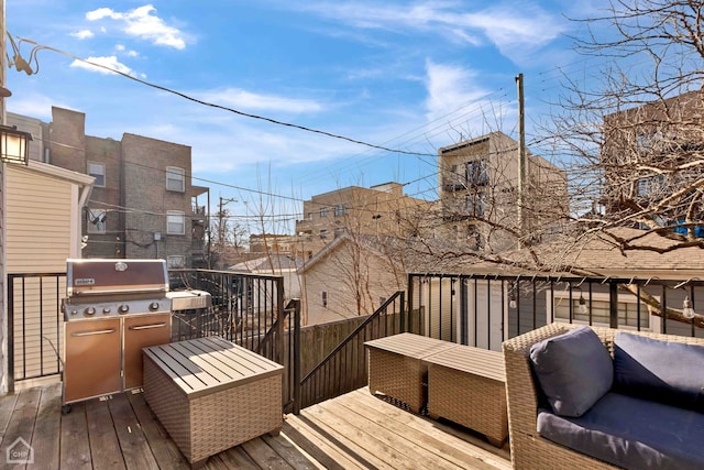 wooden terrace featuring area for grilling