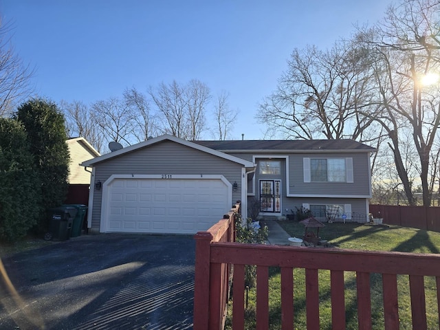 view of front of property featuring a garage and a front yard