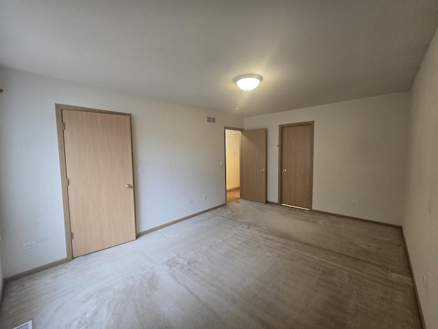 unfurnished bedroom with light carpet