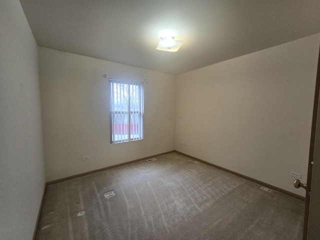 spare room featuring carpet flooring