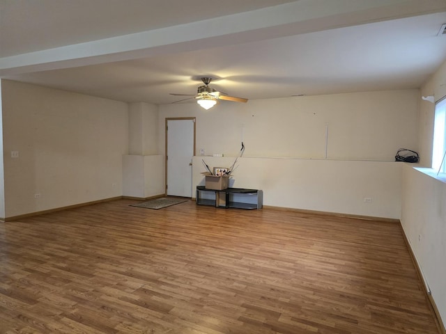 empty room with hardwood / wood-style flooring and ceiling fan