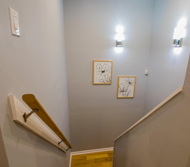 stairs with hardwood / wood-style floors