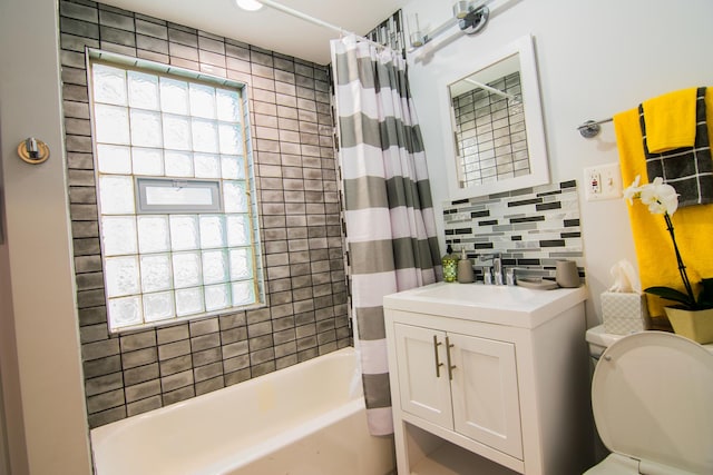 full bathroom featuring shower / bath combination with curtain, vanity, tasteful backsplash, and toilet