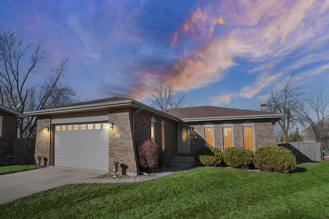 view of front of house with a garage, concrete driveway, brick siding, and fence