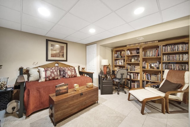 tiled bedroom with a drop ceiling