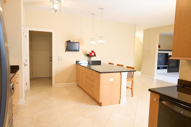 kitchen with hanging light fixtures, stainless steel dishwasher, light brown cabinetry, kitchen peninsula, and a breakfast bar area