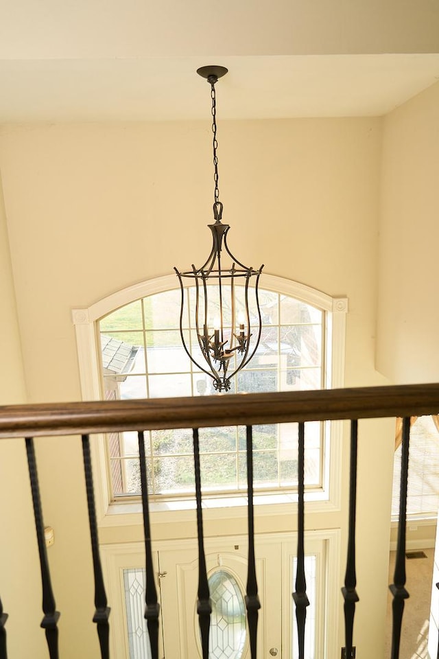 interior details featuring a chandelier