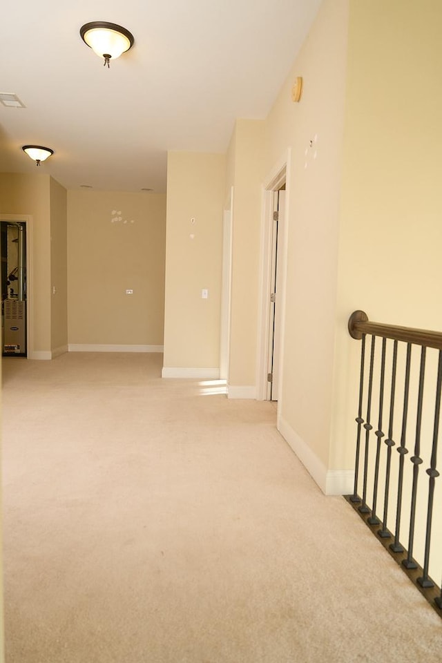 spare room with light colored carpet