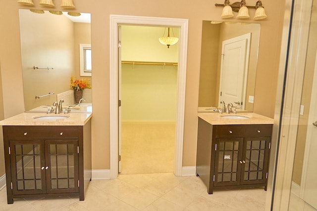 bathroom with tile patterned flooring and vanity