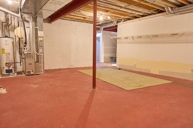 basement featuring heating unit and water heater