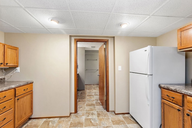 kitchen featuring white fridge