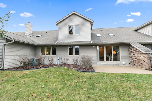 back of house featuring a yard, a patio, and central air condition unit