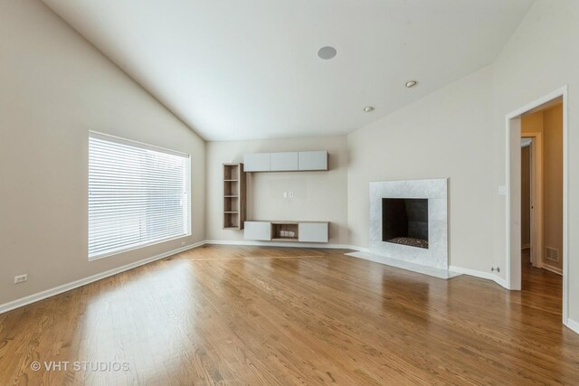 interior space with lofted ceiling and dark hardwood / wood-style floors