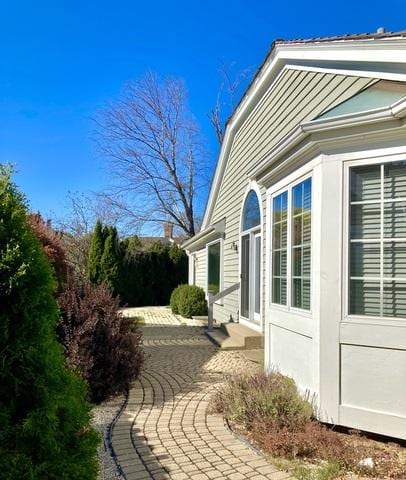 view of side of home with a patio