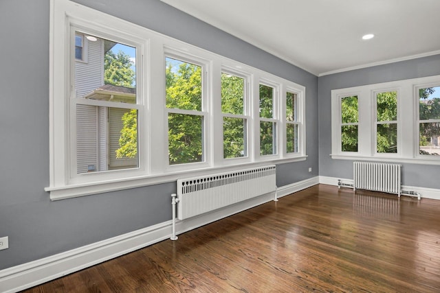 unfurnished sunroom featuring radiator heating unit