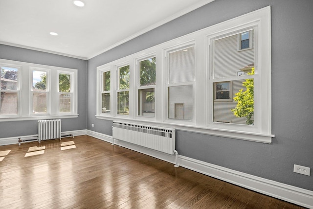 unfurnished sunroom with radiator heating unit