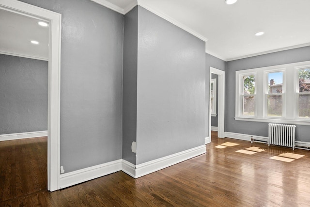 interior space featuring radiator heating unit, crown molding, and wood-type flooring