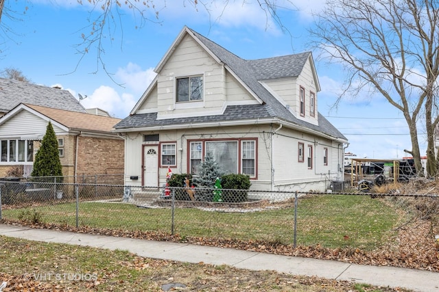 bungalow-style home featuring cooling unit and a front yard