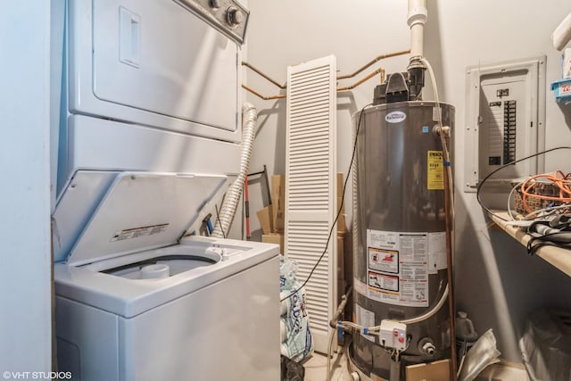 laundry room with stacked washer and dryer and water heater