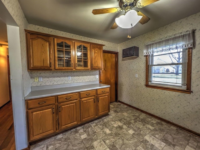 kitchen featuring ceiling fan and a wall unit AC