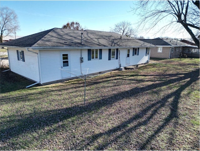 back of house with a yard