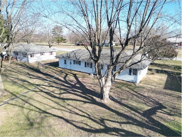 view of property exterior featuring a yard