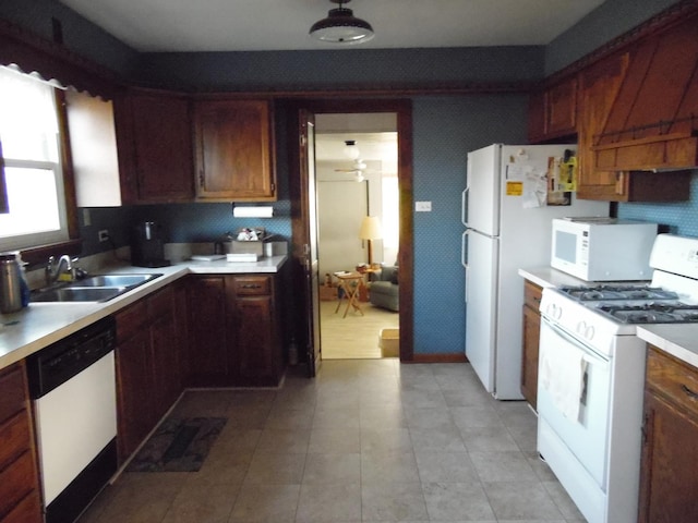 kitchen featuring sink, white appliances, ceiling fan, and custom exhaust hood