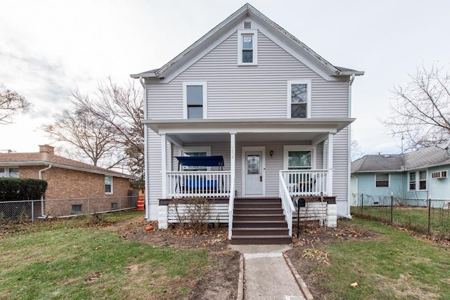 view of front of house featuring a front yard and a porch