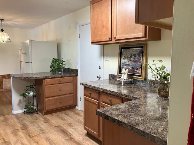 kitchen with dark countertops, wood ceiling, and brown cabinets