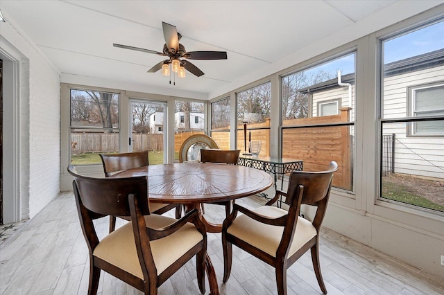 sunroom / solarium with ceiling fan and a wealth of natural light