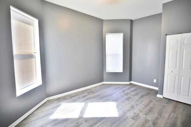 unfurnished room featuring light wood-type flooring