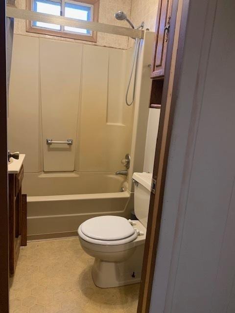 full bathroom with vanity, toilet, and washtub / shower combination