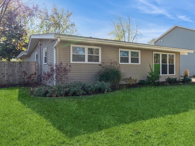 view of side of property featuring a lawn