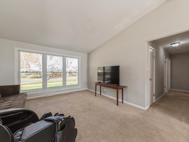 living room featuring light carpet and lofted ceiling