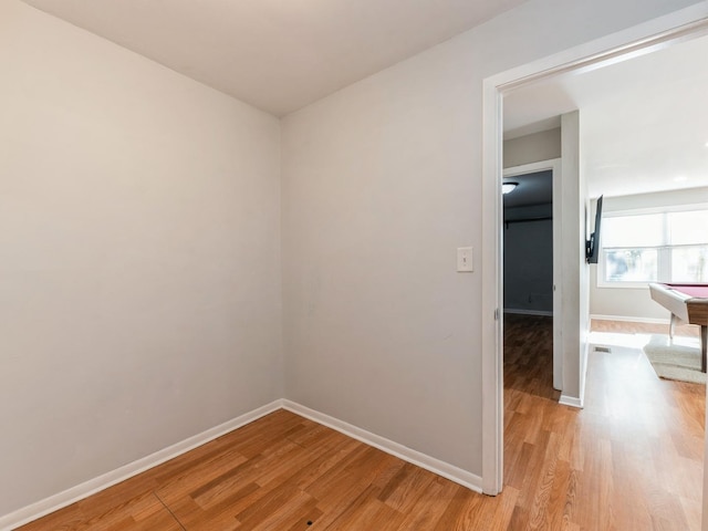 spare room with light hardwood / wood-style floors and billiards