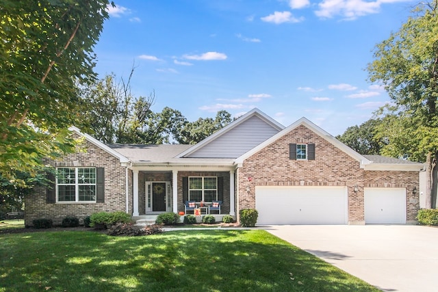 view of front facade featuring a front yard, a garage, and covered porch