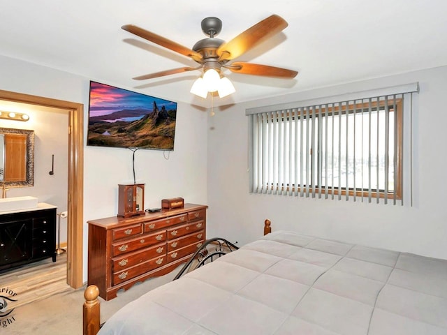 bedroom with ceiling fan and ensuite bathroom