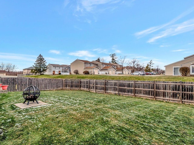 view of yard featuring an outdoor fire pit