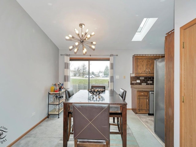 dining room featuring light carpet and an inviting chandelier