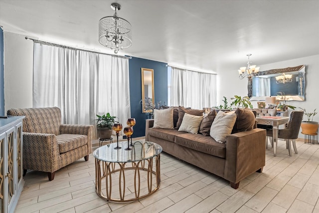 living room with a chandelier and light wood-type flooring